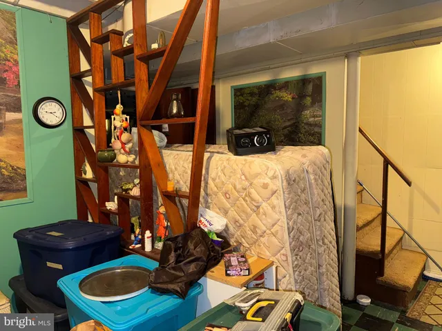 a view of a livingroom with furniture and a window