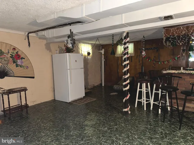 a room with pool table and a rug