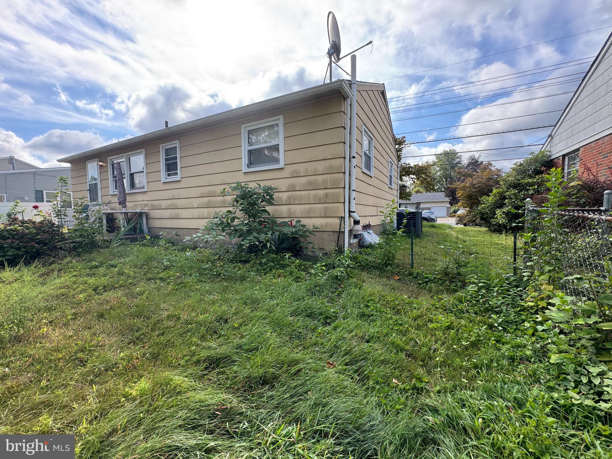 609 Evesham Avenue West Magnolia, NJ 08049 - Photo 10 of 73 a backyard of a house with plants and garden
