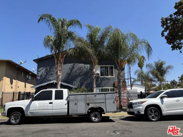 a view of a car parked in front of a house