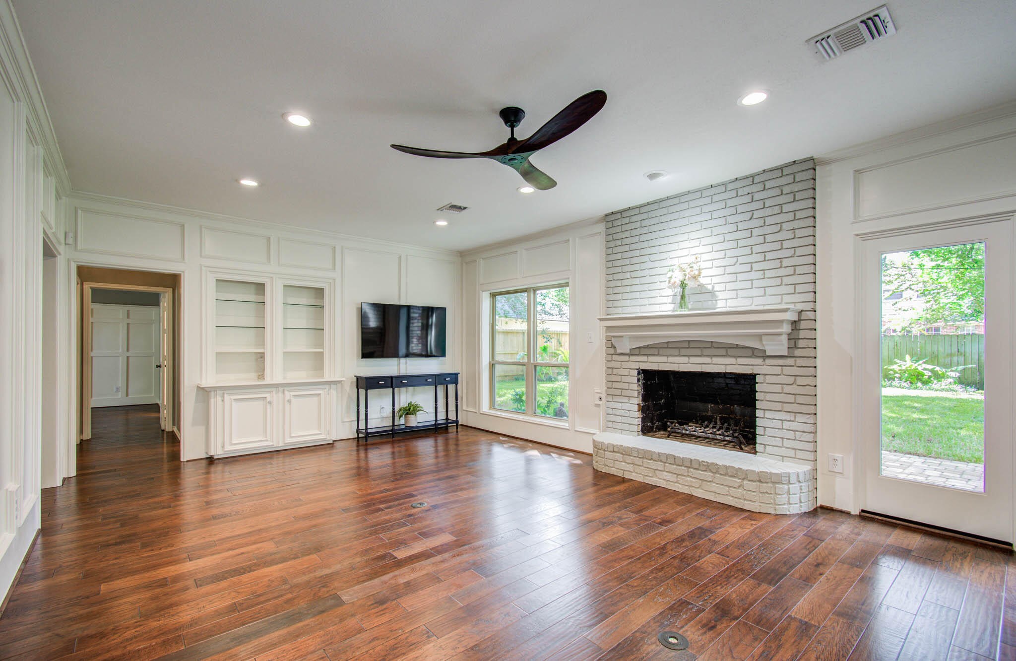 16267 Salmon Lane Spring, TX 77379 - Photo 14 of 48 a view of a livingroom with a fireplace wooden floor and window