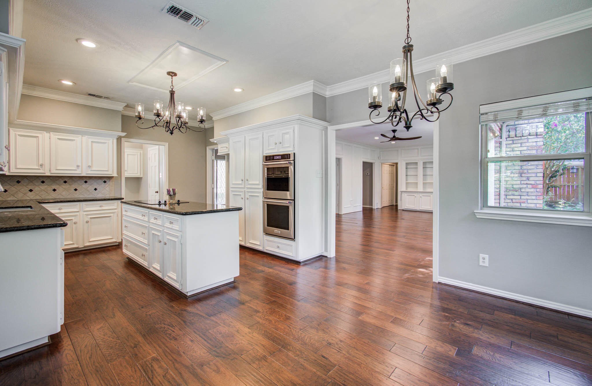 16267 Salmon Lane Spring, TX 77379 - Photo 17 of 48 a large kitchen with stainless steel appliances granite countertop a stove oven and a wooden floors