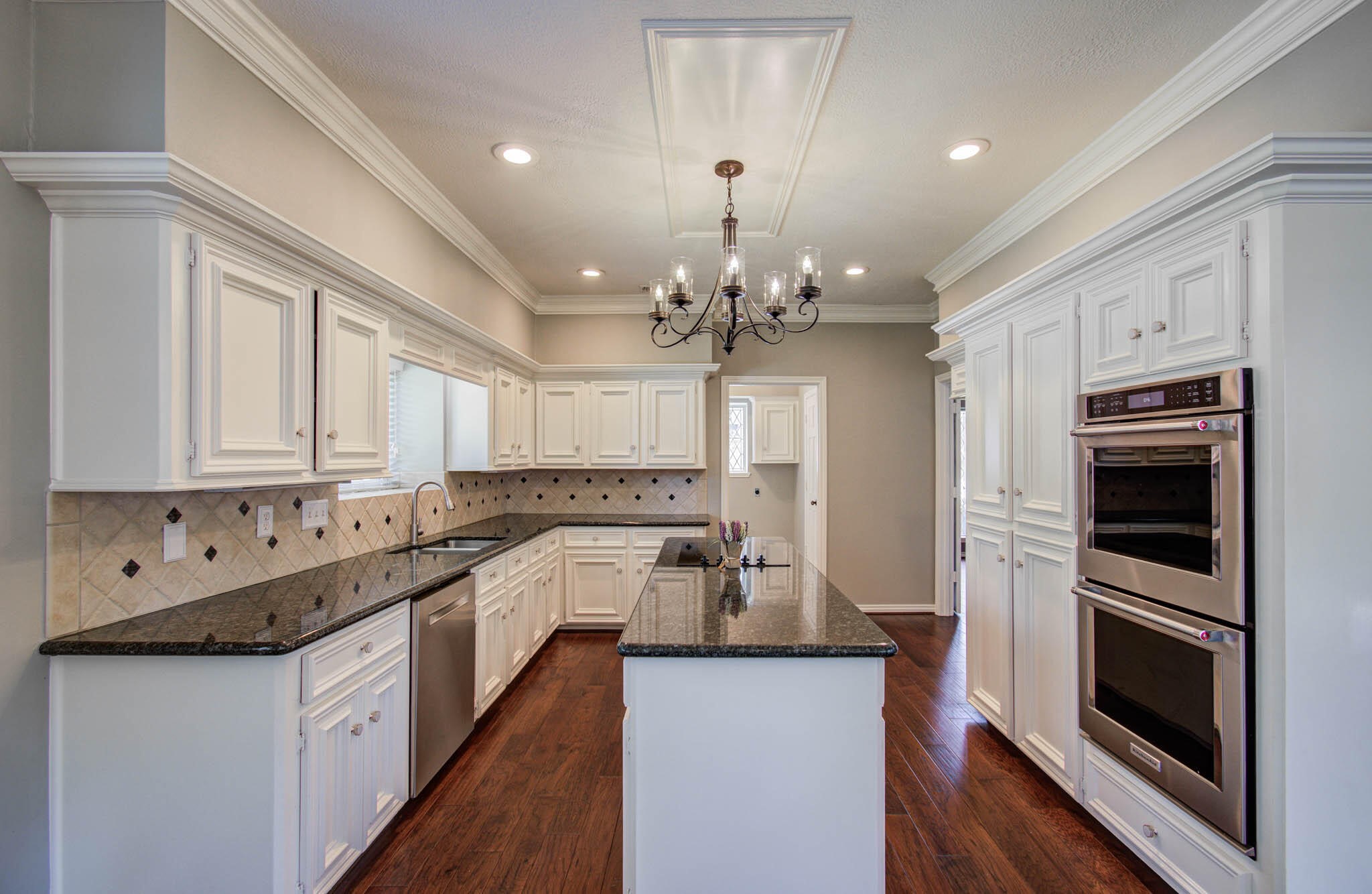 16267 Salmon Lane Spring, TX 77379 - Photo 19 of 48 a kitchen with a sink stove and microwave