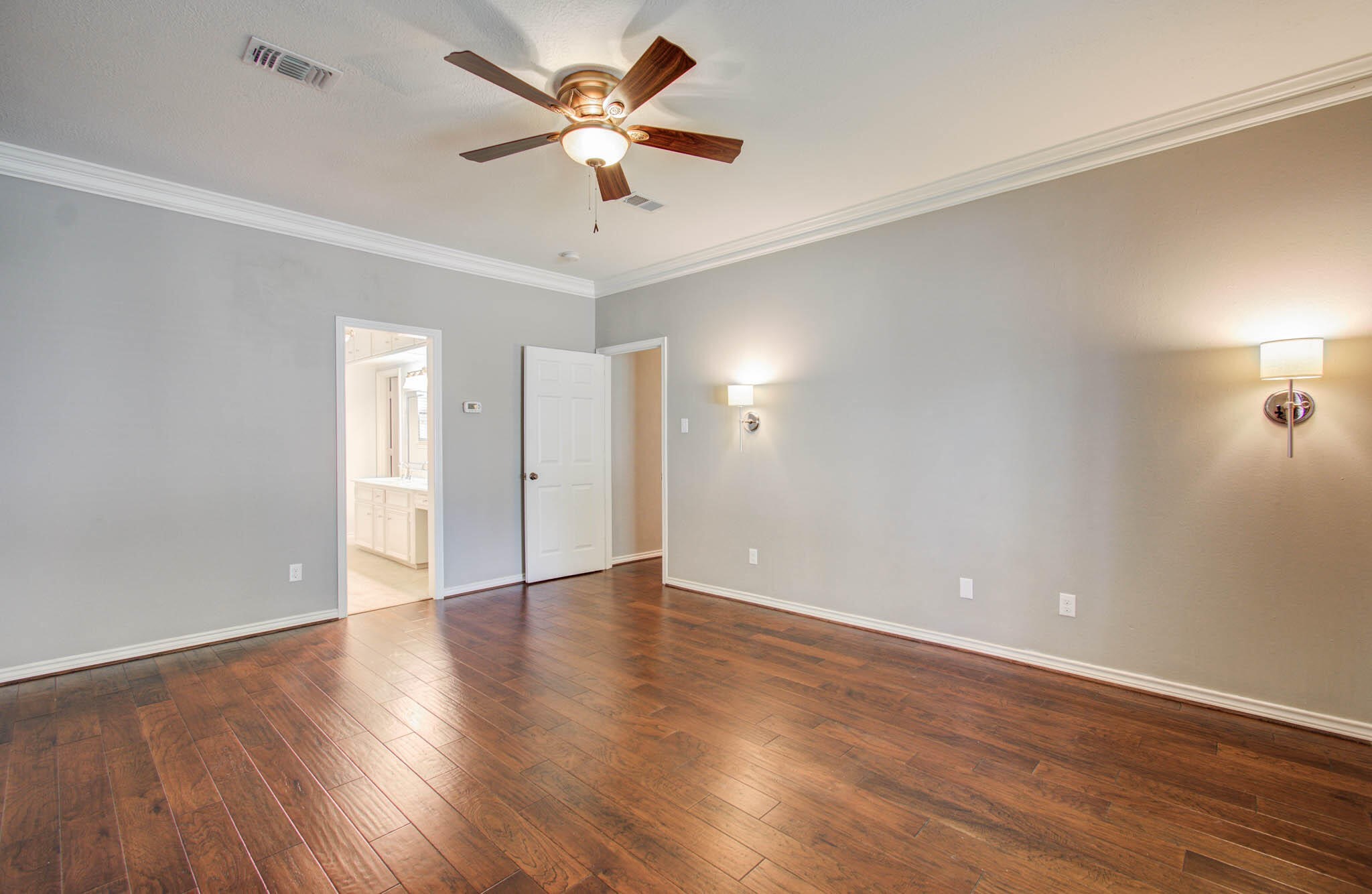 16267 Salmon Lane Spring, TX 77379 - Photo 28 of 48 an empty room with wooden floor and a ceiling fan