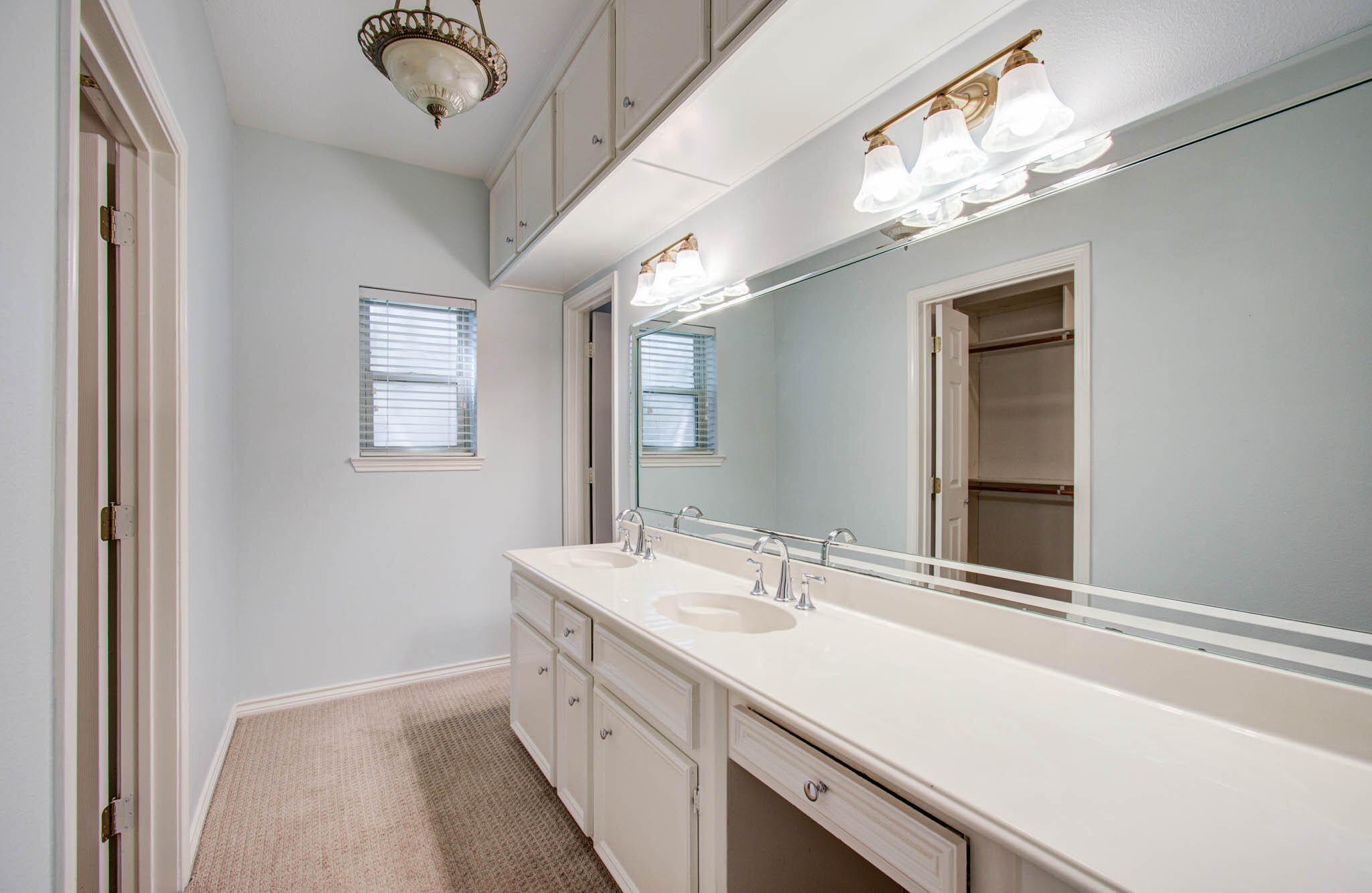 16267 Salmon Lane Spring, TX 77379 - Photo 29 of 48 a bathroom with a sink a large mirror and a vanity