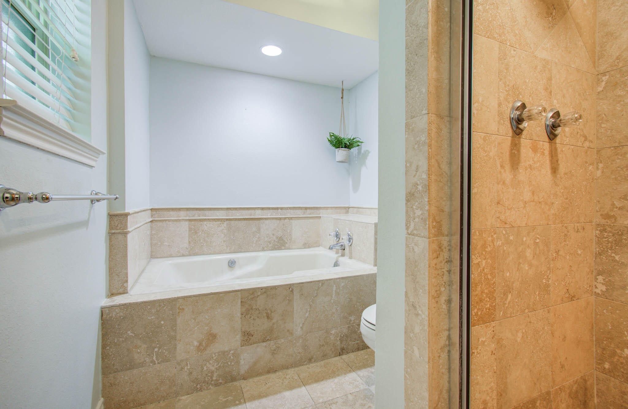 16267 Salmon Lane Spring, TX 77379 - Photo 31 of 48 a bathroom with a bathtub and shower