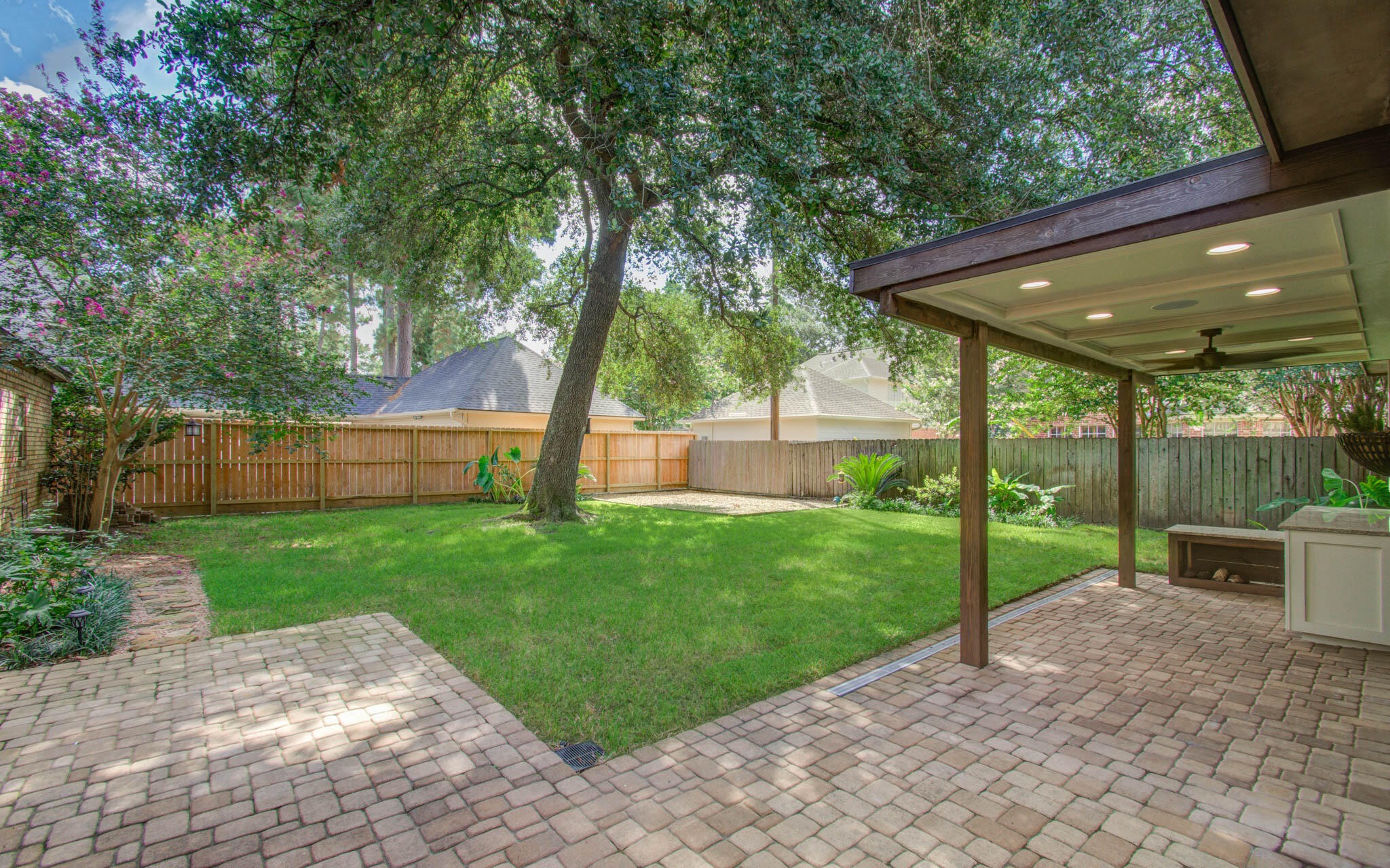16267 Salmon Lane Spring, TX 77379 - Photo 45 of 48 a view of a backyard with plants and a garden