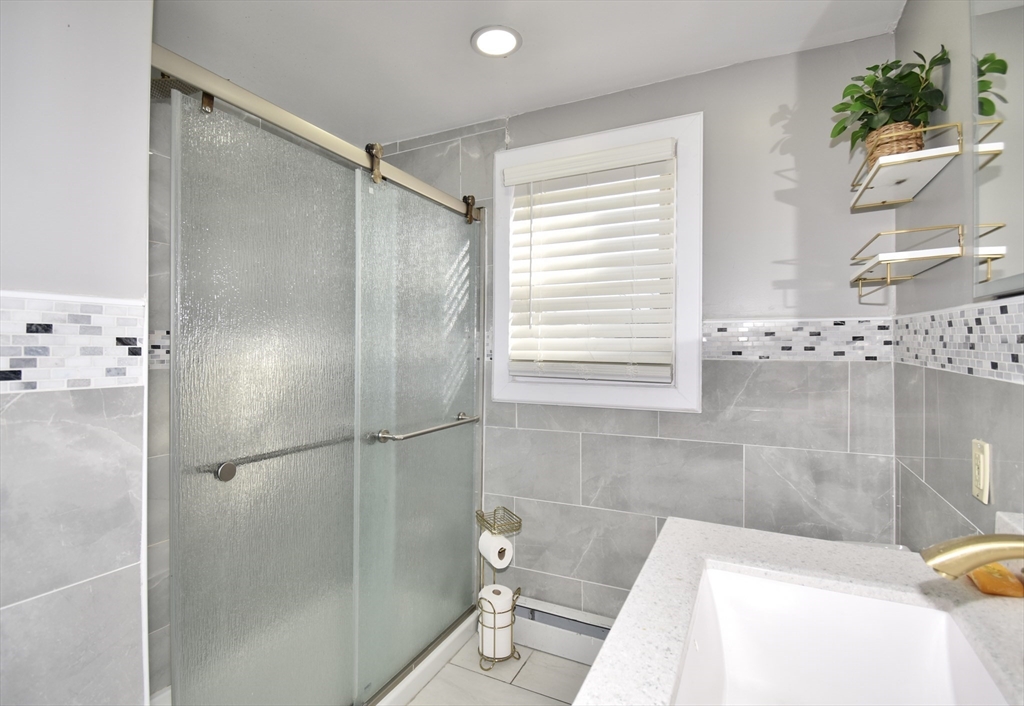 85 Orchard Street Chicopee, MA 01013 - Photo 17 of 33 a bathroom with a tub and a shower