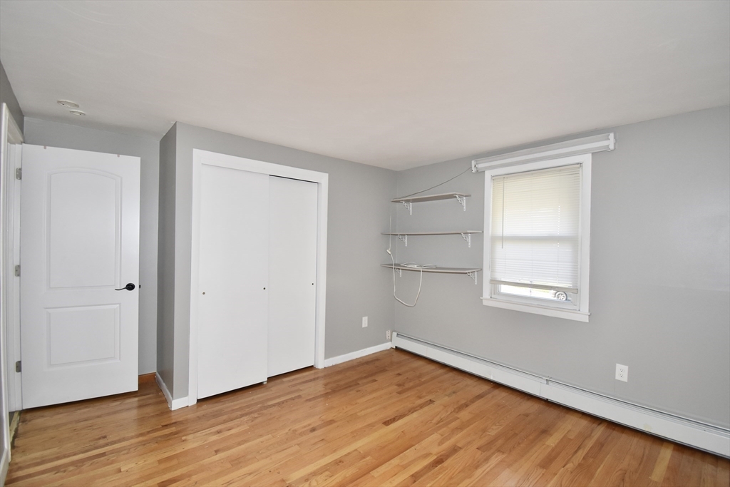 85 Orchard Street Chicopee, MA 01013 - Photo 19 of 33 a view of an empty room with wooden floor and a window