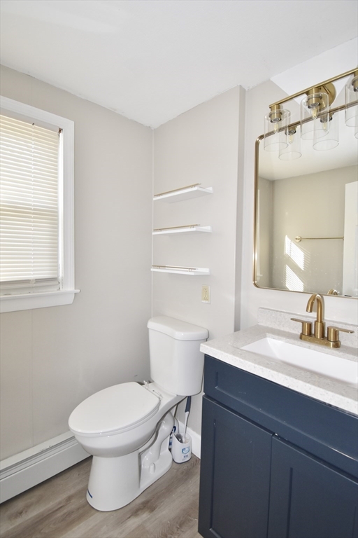 85 Orchard Street Chicopee, MA 01013 - Photo 21 of 33 a bathroom with a sink a toilet and a window