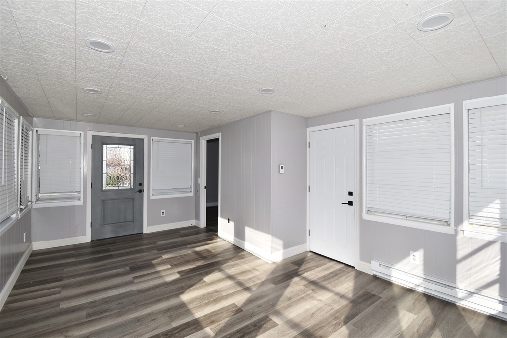 85 Orchard Street Chicopee, MA 01013 - Photo 22 of 33 a view of a room with wooden floor and window