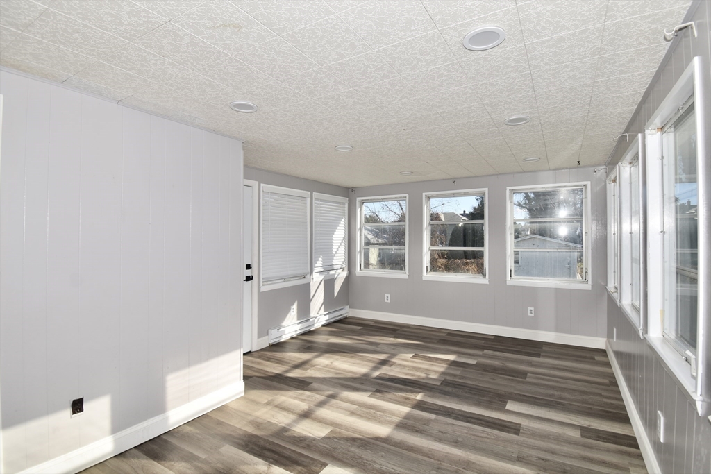 85 Orchard Street Chicopee, MA 01013 - Photo 23 of 33 a view of wooden floor and windows in a room