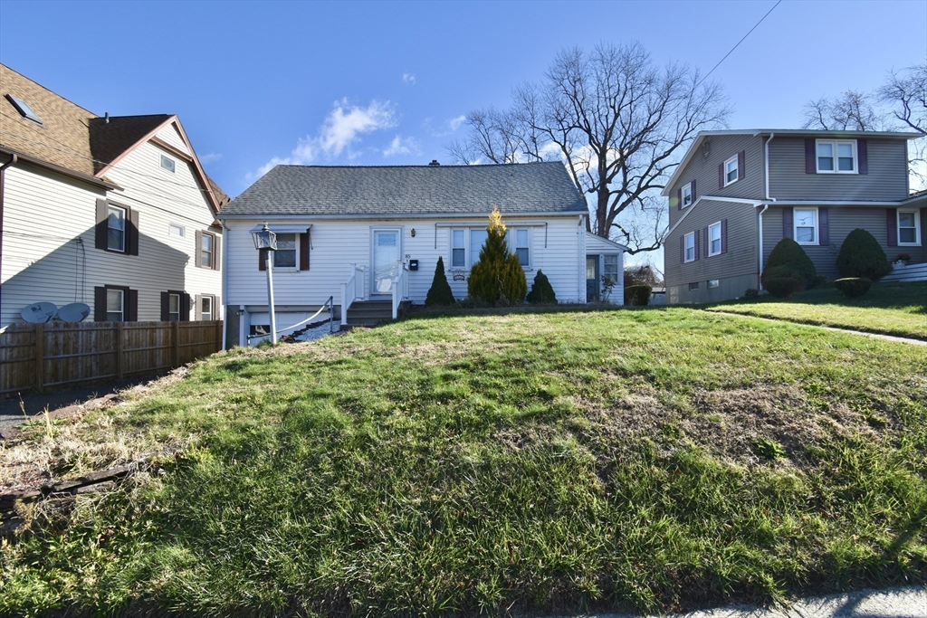 85 Orchard Street Chicopee, MA 01013 - Photo 31 of 33 a view of a house with a yard
