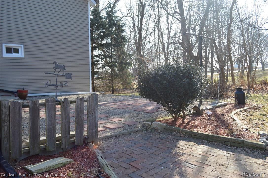 7575 North Fowlerville Road Fowlerville, MI 48836 - Photo 27 of 34 Back Patio with Brick Pavers!