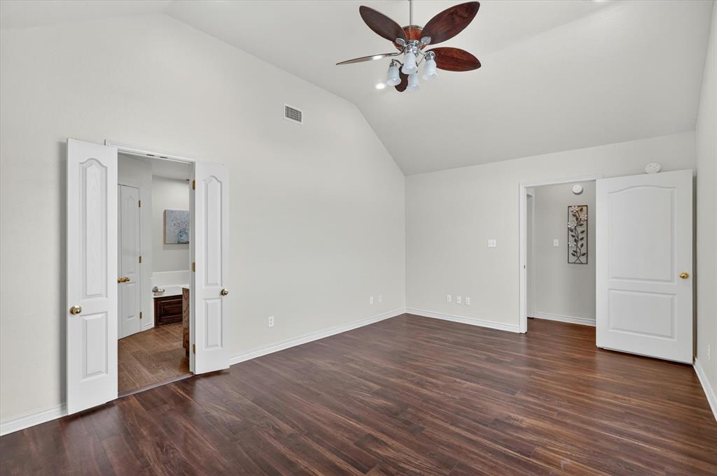 2828 Bennett Road Howe, TX 75459 - Photo 17 of 39 an empty room with wooden floor and windows