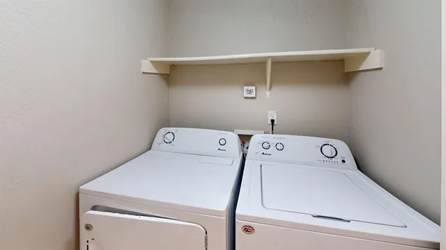 a utility room with dryer and washer