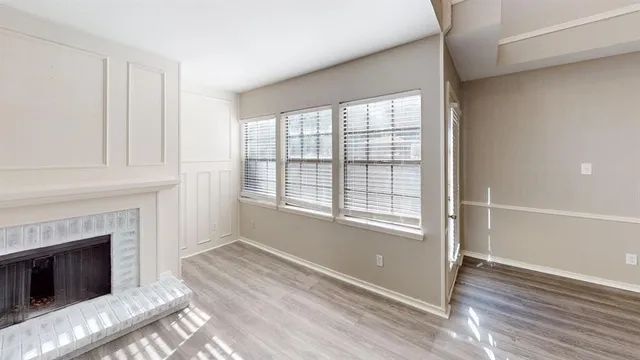 a living room with a fireplace furniture and a window