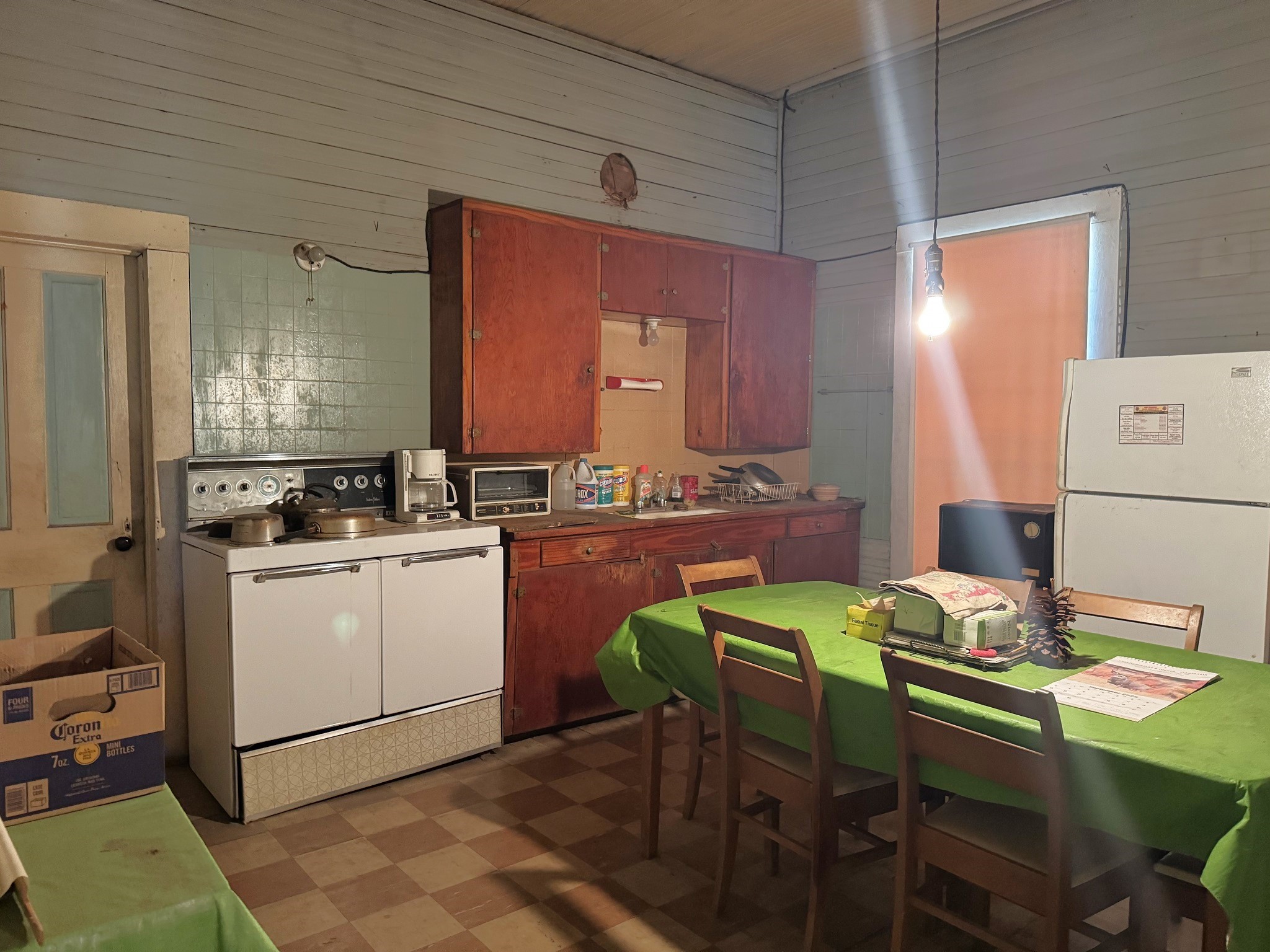 Tbd South Pitzer Street Colmesneil, TX 75938 - Photo 13 of 43 a kitchen with a table chairs and a refrigerator