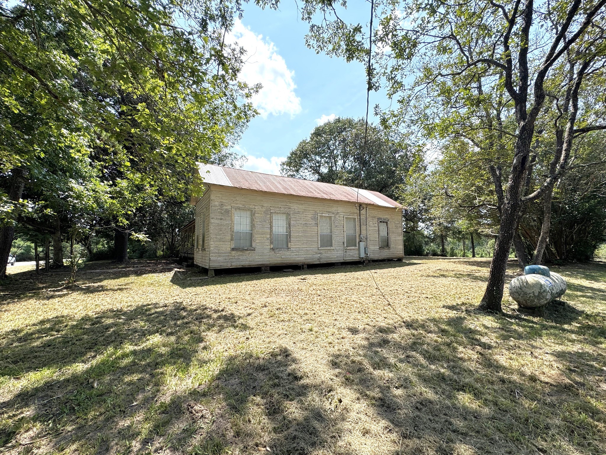 Tbd South Pitzer Street Colmesneil, TX 75938 - Photo 33 of 43 a house with trees in the background