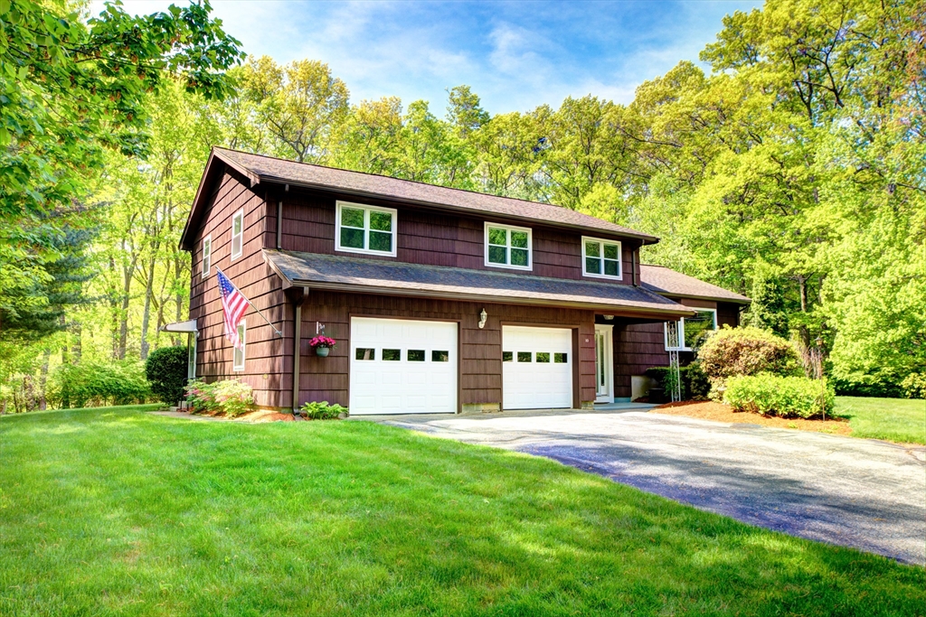 10 Long Meadow Road Chelmsford, MA 01824 - Photo 1 of 42 a front view of a house with a yard