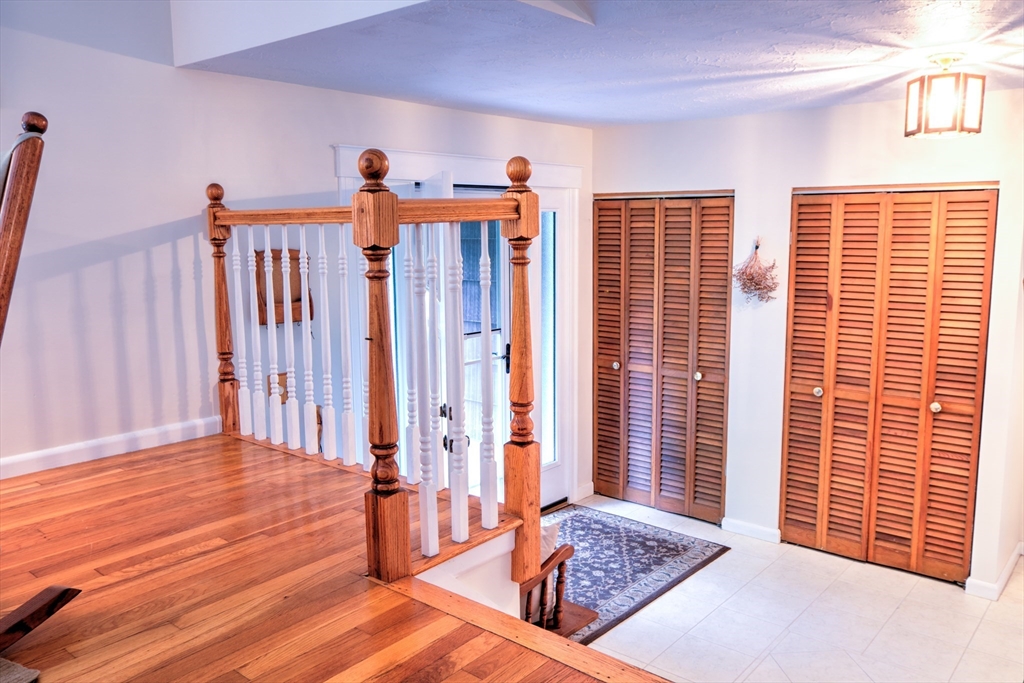 10 Long Meadow Road Chelmsford, MA 01824 - Photo 12 of 42 a view of a bedroom with wooden floor and windows