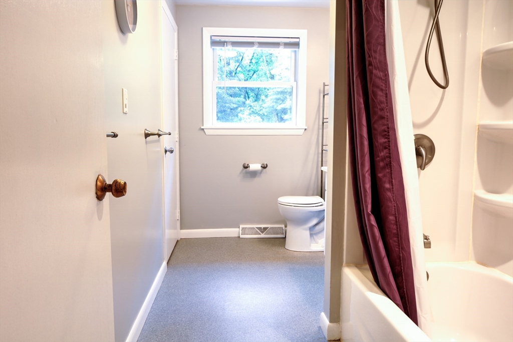 10 Long Meadow Road Chelmsford, MA 01824 - Photo 13 of 42 a view of a bathroom with a toilet and a window
