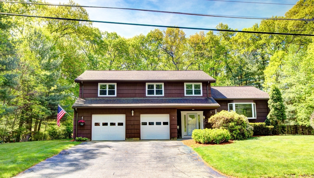 10 Long Meadow Road Chelmsford, MA 01824 - Photo 26 of 42 a front view of a house with a garden and plants