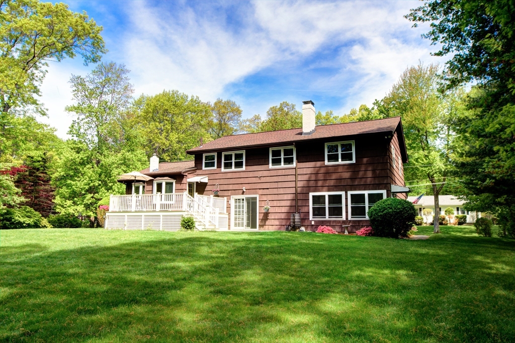 10 Long Meadow Road Chelmsford, MA 01824 - Photo 32 of 42 a front view of a house with a garden