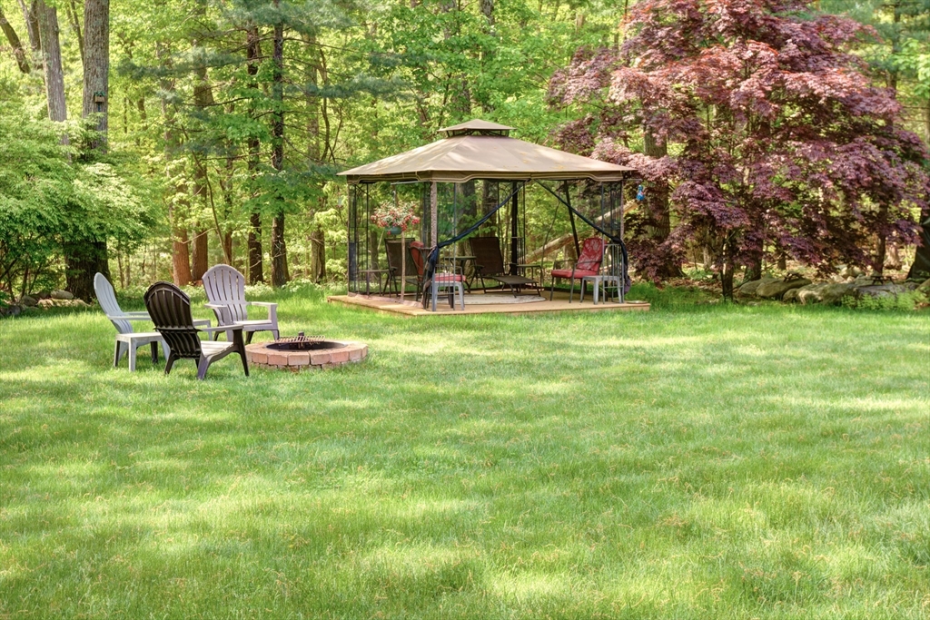 10 Long Meadow Road Chelmsford, MA 01824 - Photo 38 of 42 a view of a table and chairs under an umbrella