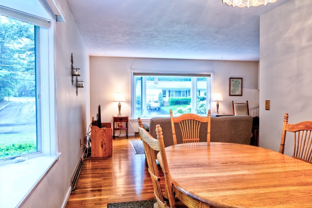 10 Long Meadow Road Chelmsford, MA 01824 - Photo 5 of 42 a dining room with furniture and wooden floor