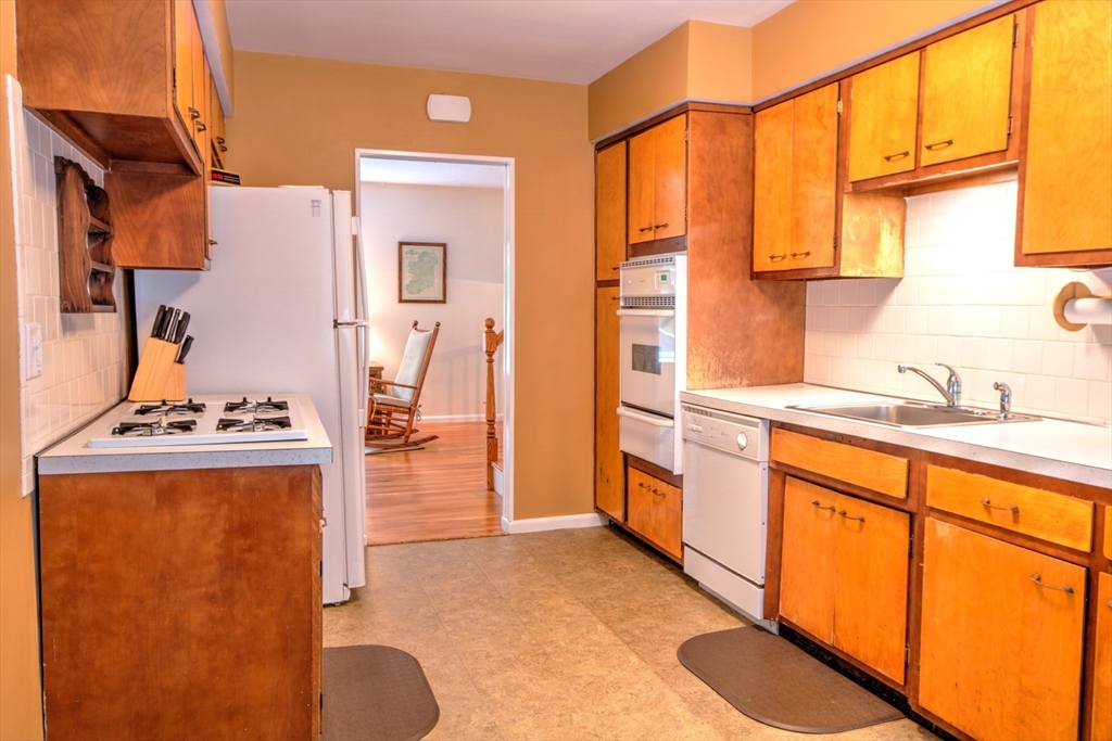 10 Long Meadow Road Chelmsford, MA 01824 - Photo 8 of 42 a bathroom with a granite countertop sink and a mirror