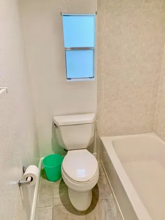 a bathroom with a granite countertop sink and mirror