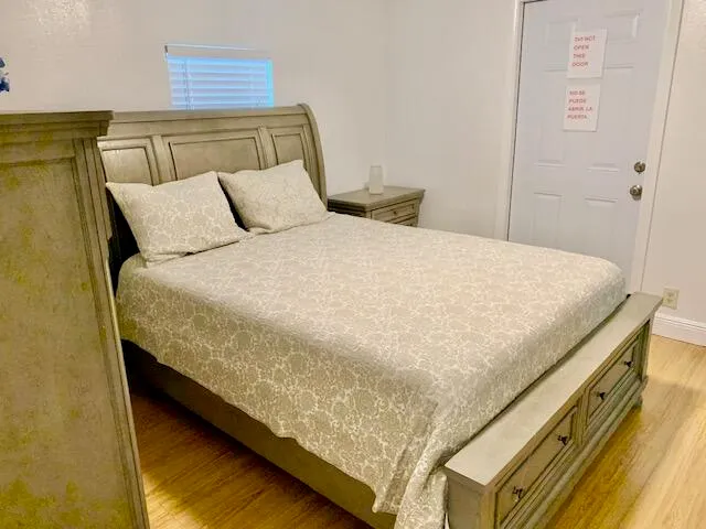 a view of a tennis court with sitting area
