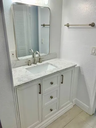 a front view of house with yard swimming pool and outdoor seating