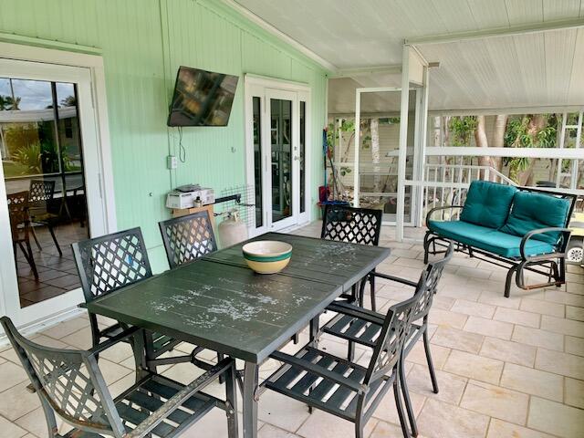 818 South Emerald Drive Key Largo, FL 33037 - Photo 3 of 44 FRONT SCREENED PORCH.