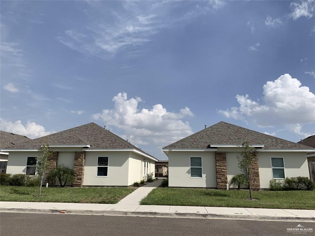 420 Teague Avenue, Unit 4 Edinburg, TX 78539 - Photo 1 of 14 a front view of a house with a garden
