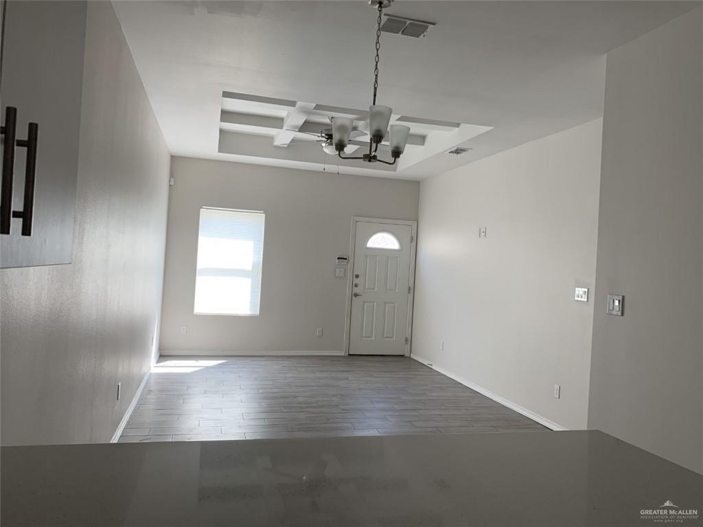 420 Teague Avenue, Unit 4 Edinburg, TX 78539 - Photo 4 of 14 a view of a room with windows and ceiling fan