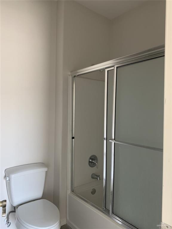 420 Teague Avenue, Unit 4 Edinburg, TX 78539 - Photo 10 of 14 a bathroom with a toilet and a shower