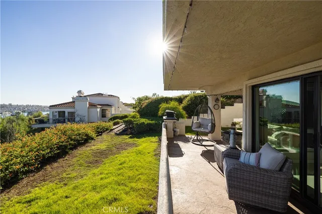 a view of a patio with couches and potted plants