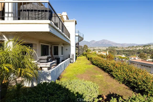 a view of a house with swimming pool and sitting area
