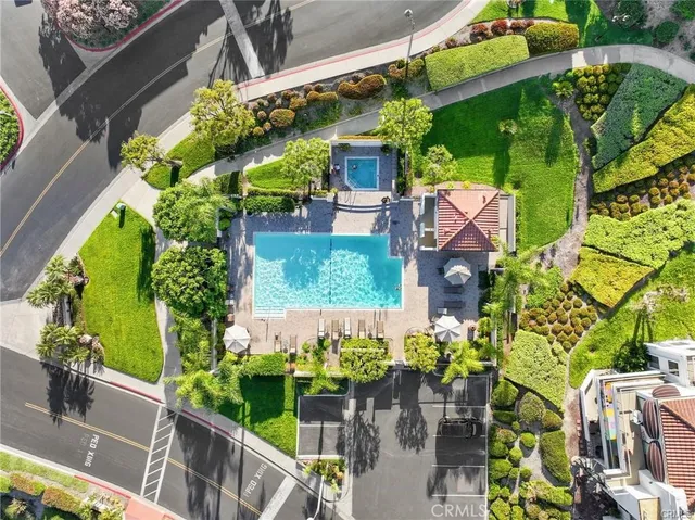 a backyard of a house with a garden and outdoor seating