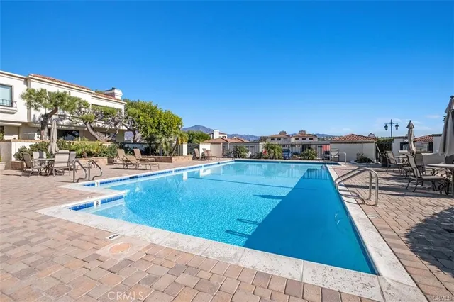 a view of swimming pool with outdoor seating