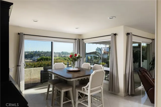 a dining room with furniture window and outside view