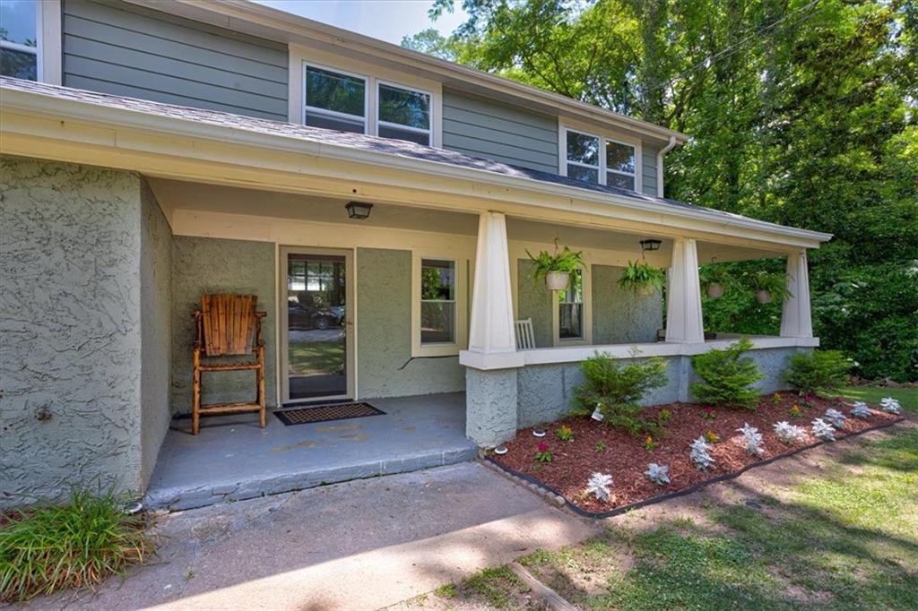 174 Rivertown Road Fairburn, GA 30213 - Photo 2 of 33 a view of a house with backyard and garden