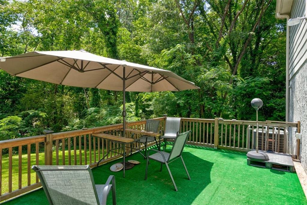 174 Rivertown Road Fairburn, GA 30213 - Photo 33 of 33 a view of a deck with furniture and a yard