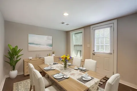 a view of a dining room with furniture window and outdoor space
