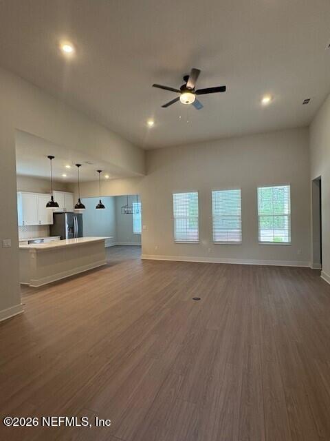 8463 Ford Road Bryceville, FL 32009 - Photo 4 of 14 a view of an empty room with window and wooden floor