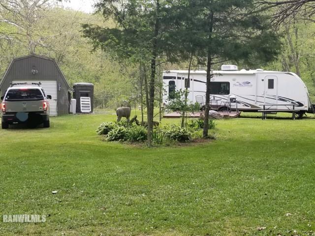 13767 3 Mile Road Savanna, IL 61074 - Photo 2 of 17 a view of a house with a back yard