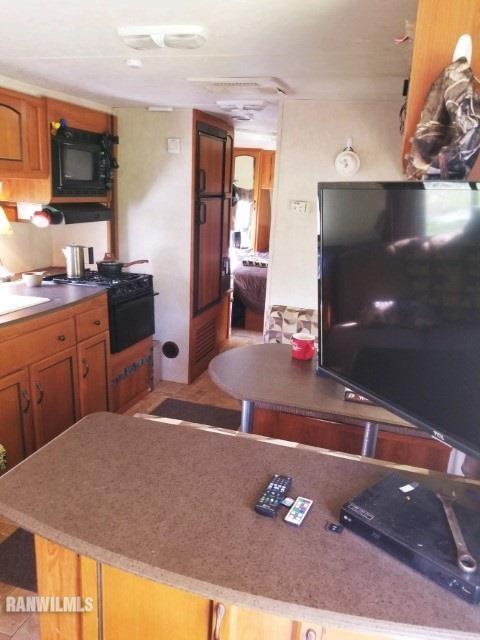 13767 3 Mile Road Savanna, IL 61074 - Photo 5 of 17 a kitchen with a sink appliances and cabinets