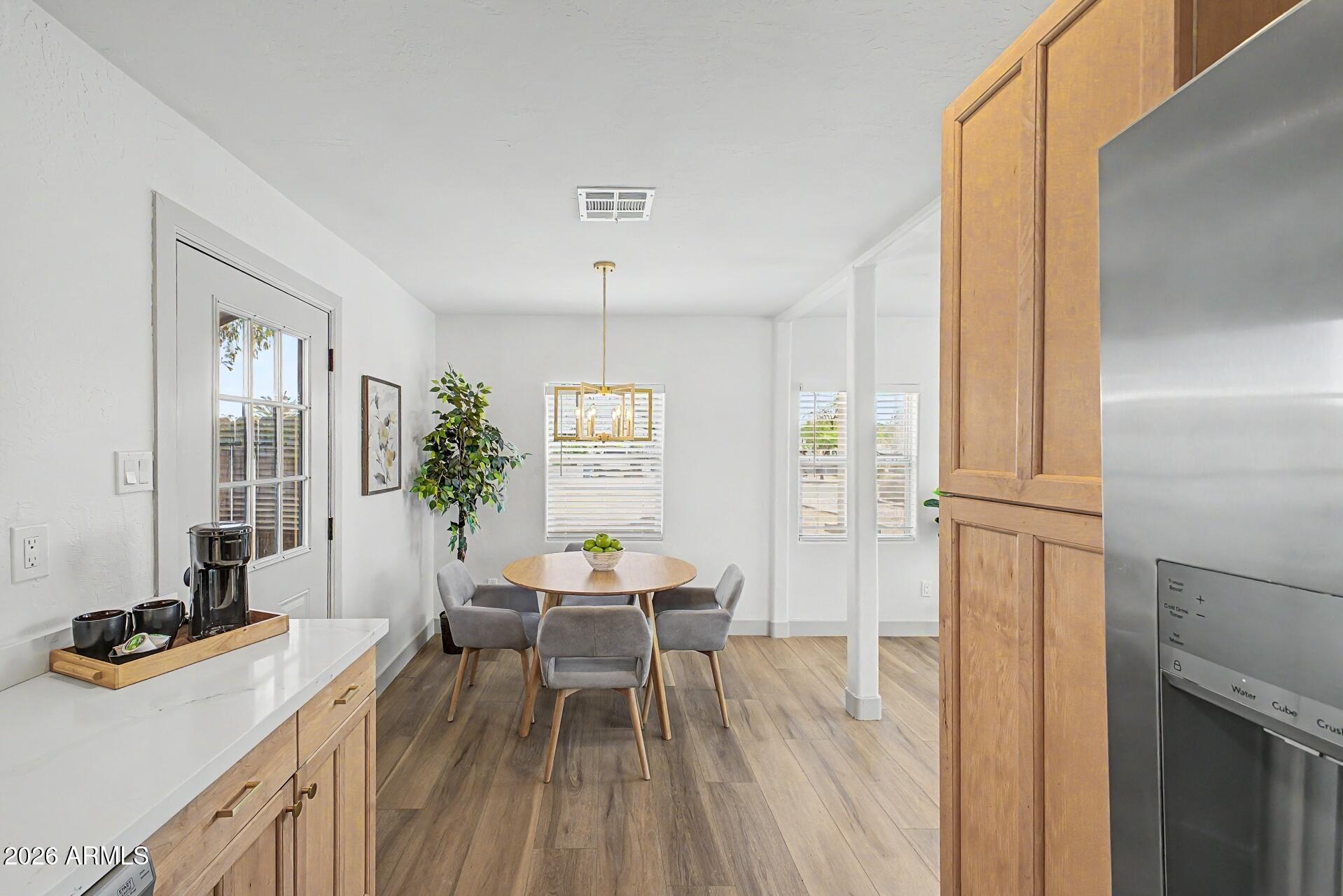 1914 East Monte Vista Road Phoenix, AZ 85006 - Photo 11 of 26 a workspace with wooden floor